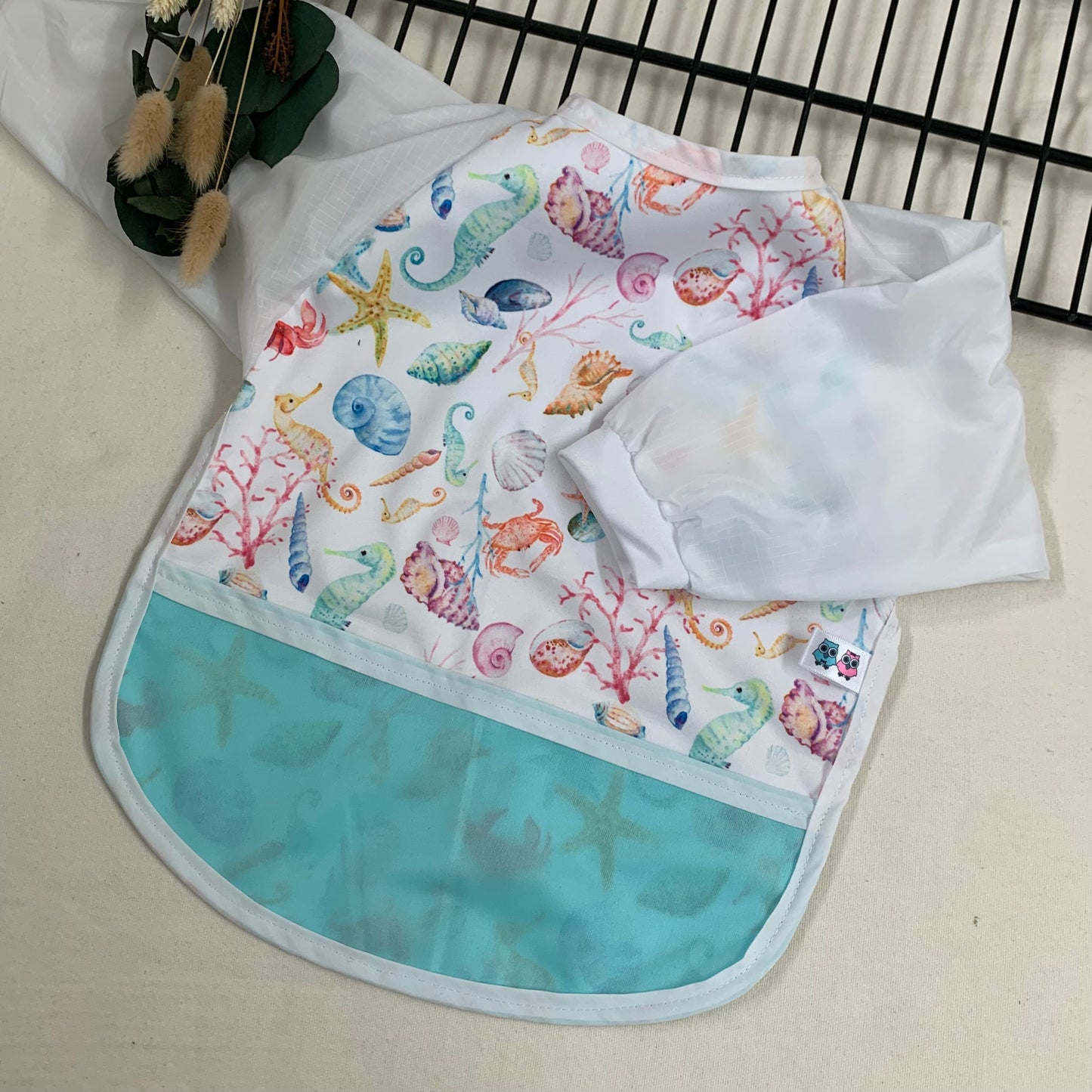 Bib/apron with sleeves Pacific Ocean